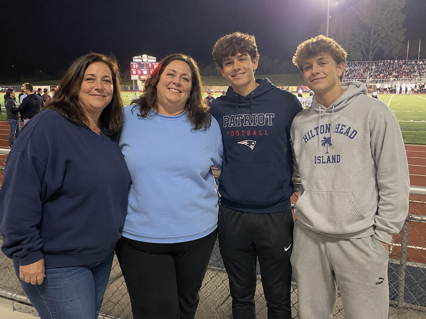 Me with my cousin Jen and our boys at a football game